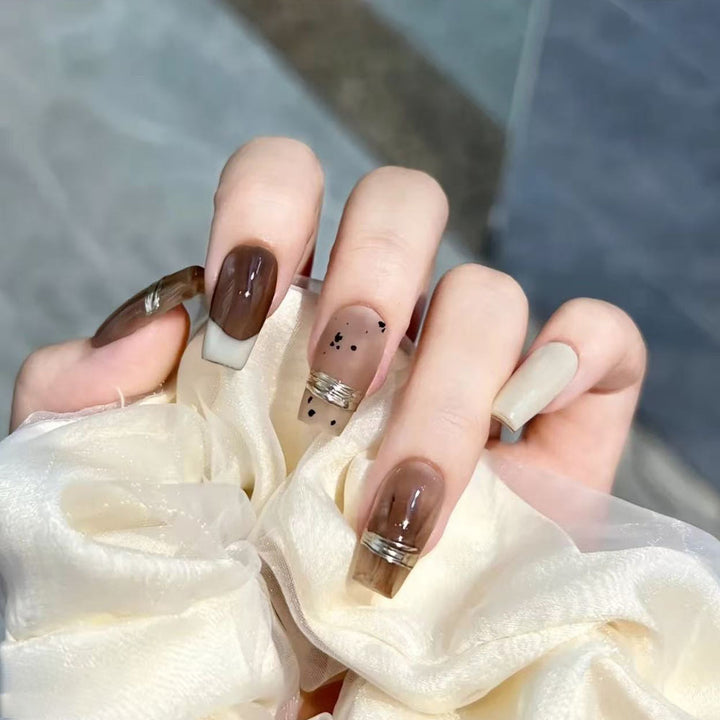 Trendy artificial nails with elegant metallic and gradient effects Stornfield