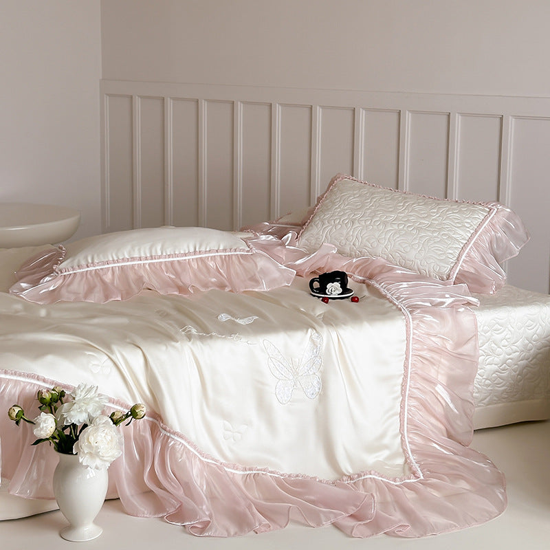 Luxurious satin bedding set with fine ruffle trimming & embroidered butterfly motifs