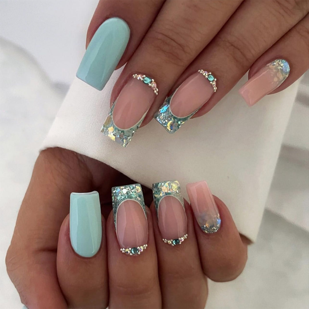 Sparkling nail art with creative rhinestone decorations Stornfield