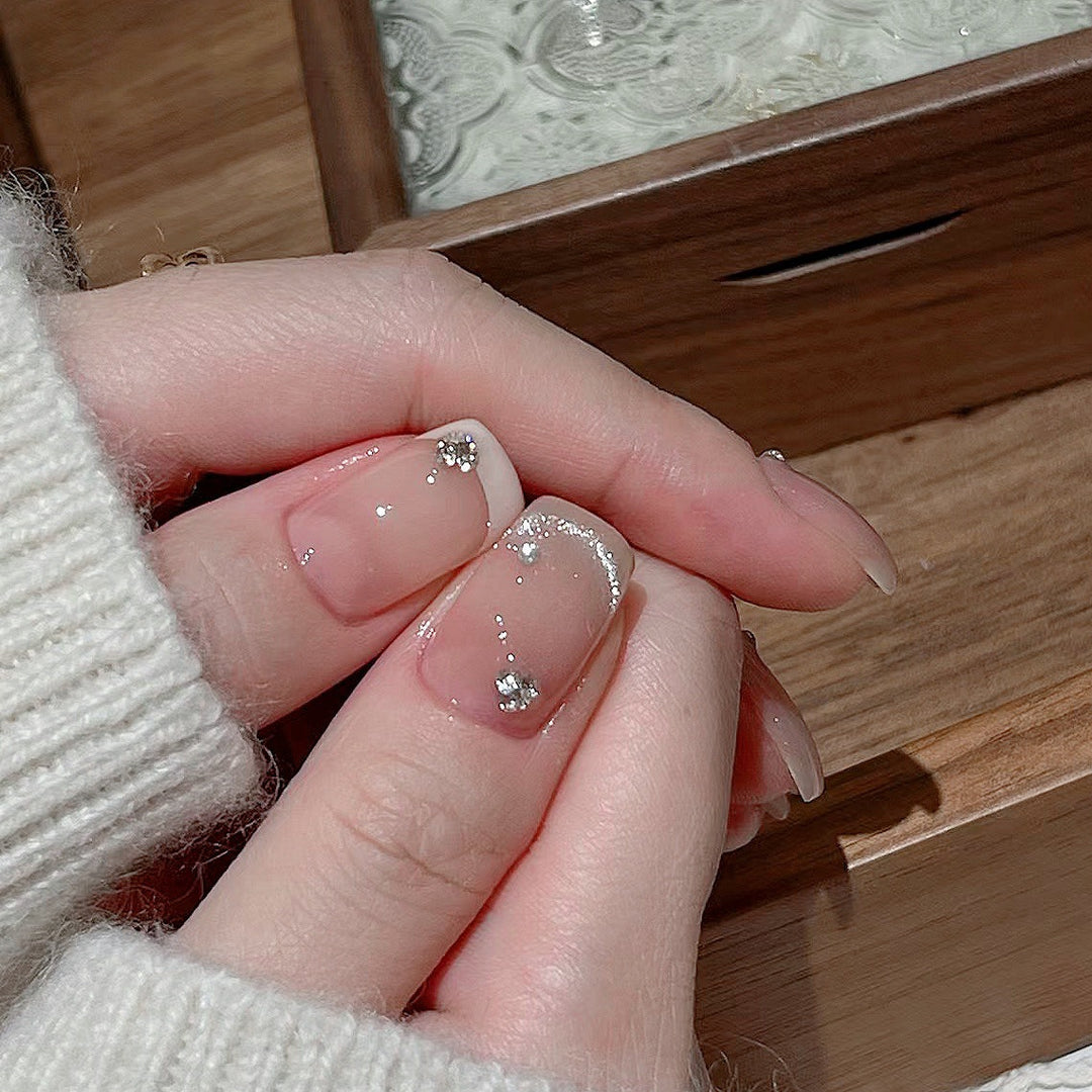 Glamorous artificial nails with filigree rhinestone details Stornfield