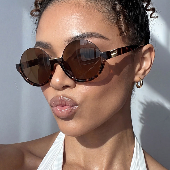 Women’s modern round sunglasses with elegant accents and UV protection Stornfield