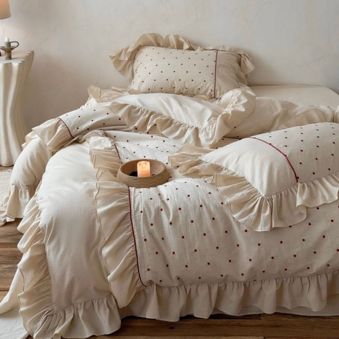 Romantic bedding set with ruffles and delicate dot embroidery