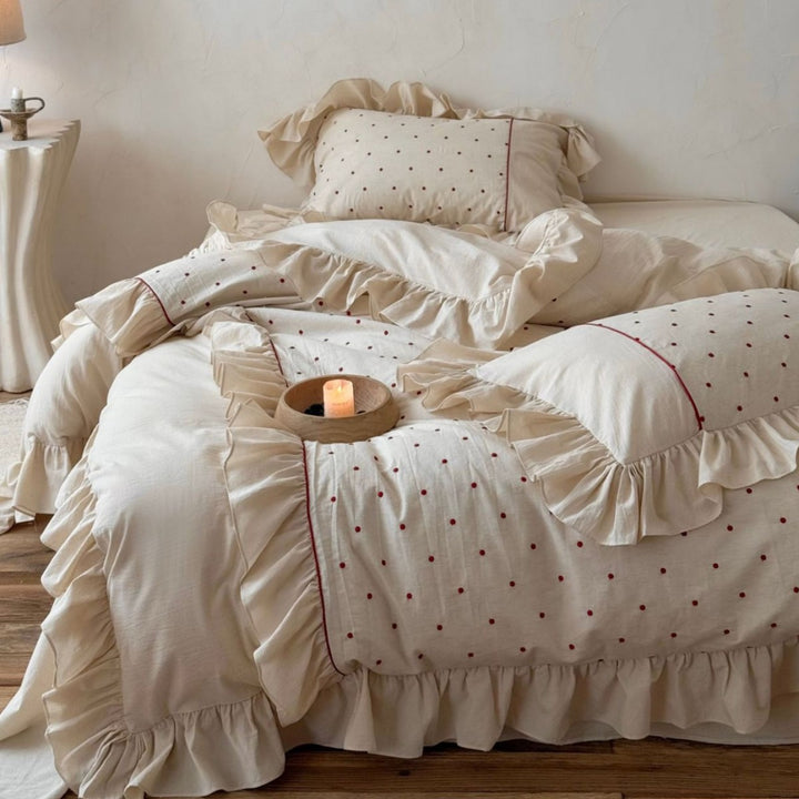 Romantic bedding set with ruffles and delicate dot embroidery