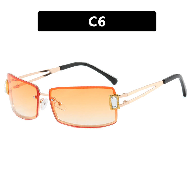 Ladies stylish sunglasses with elegant trapezoidal lenses and filigree metal frame Stornfield