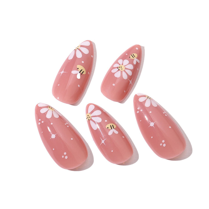 Artificial nails set with elegant flowers and glitter accents Stornfield