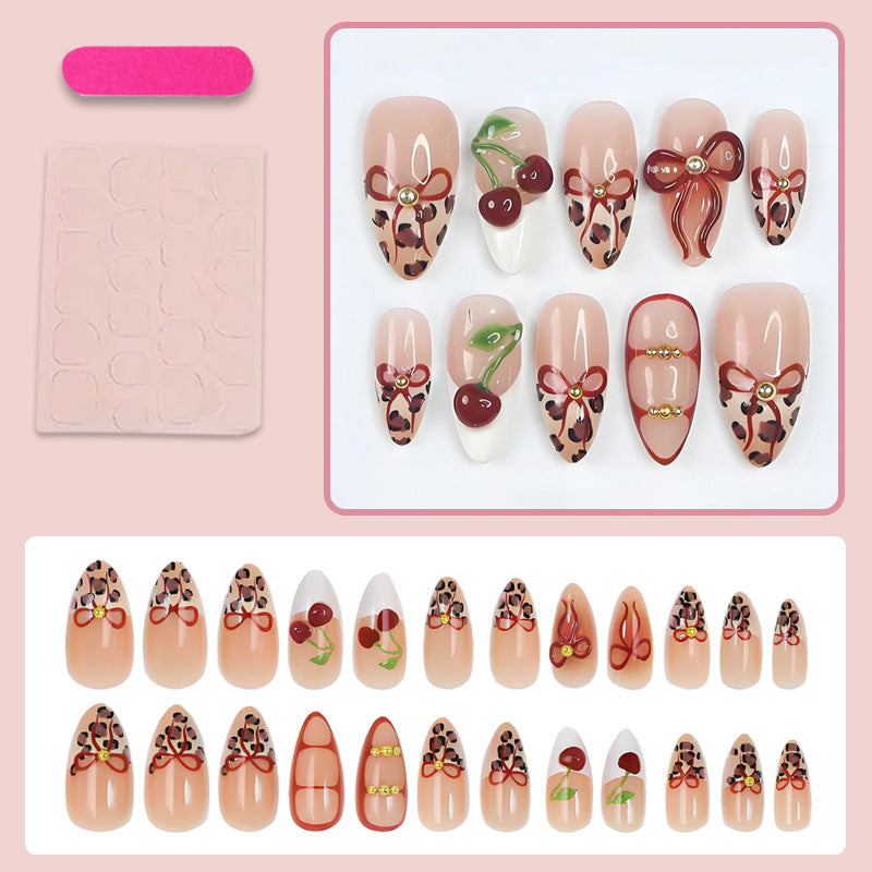 Artificial nail set with creative ribbon and fruit designs Stornfield