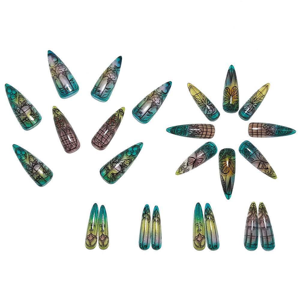 Artificial nails in elegant stiletto design with elaborate motifs Stornfield