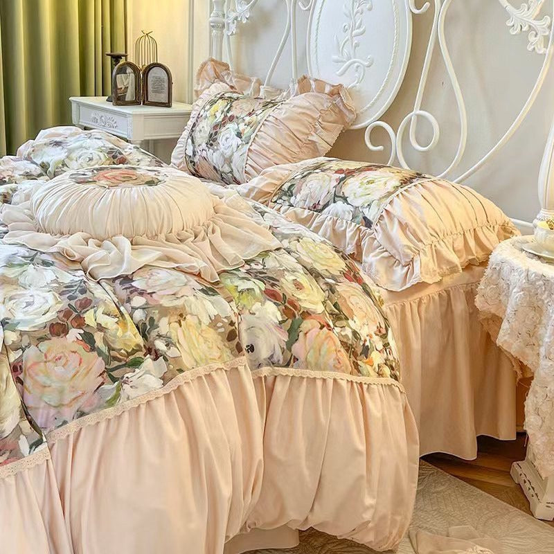 Romantic bedding set with ruffles, quilted bedspread and decorative cushion
