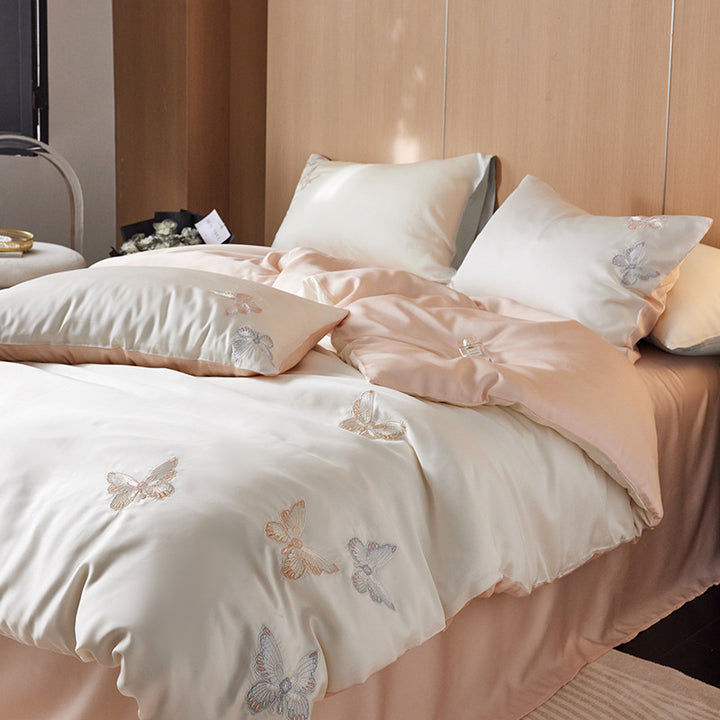 Reversible bedding set made of cotton percale with finely embroidered breakfast motifs