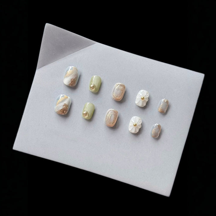 Premium Press-On Nail Art Set with Floral and Metallic Accents