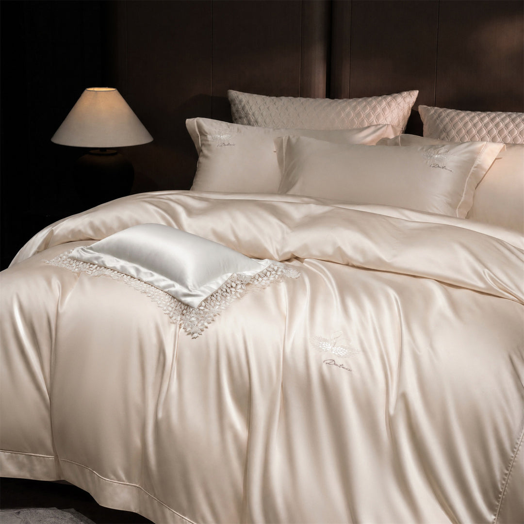 Luxurious satin bedding set with embroidered swan motif and lace pillow