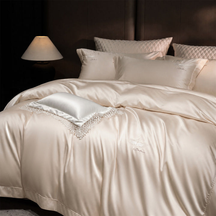 Luxurious satin bedding set with embroidered swan motif and lace pillow
