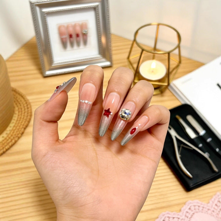 Sparkling artificial nails with decorative rhinestones Stornfield