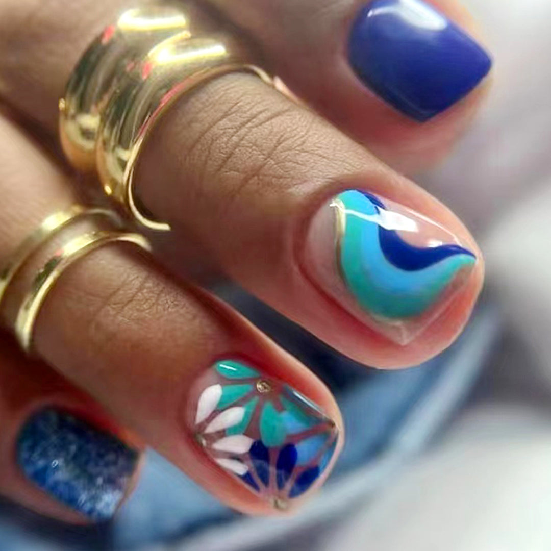 Artful nail design with floral and geometric patterns Stornfield