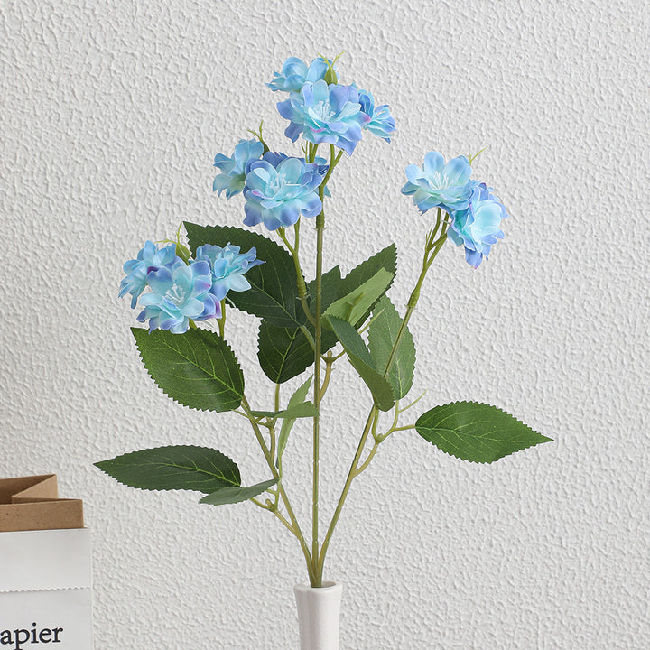 Artificial flower arrangement with delicate white blooms