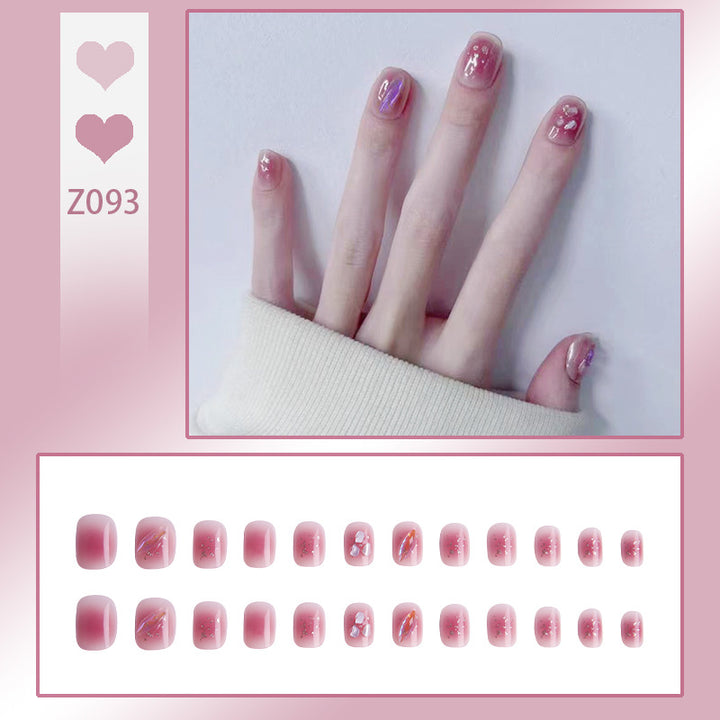Artificial nails with delicate glitter design and floral accent Stornfield