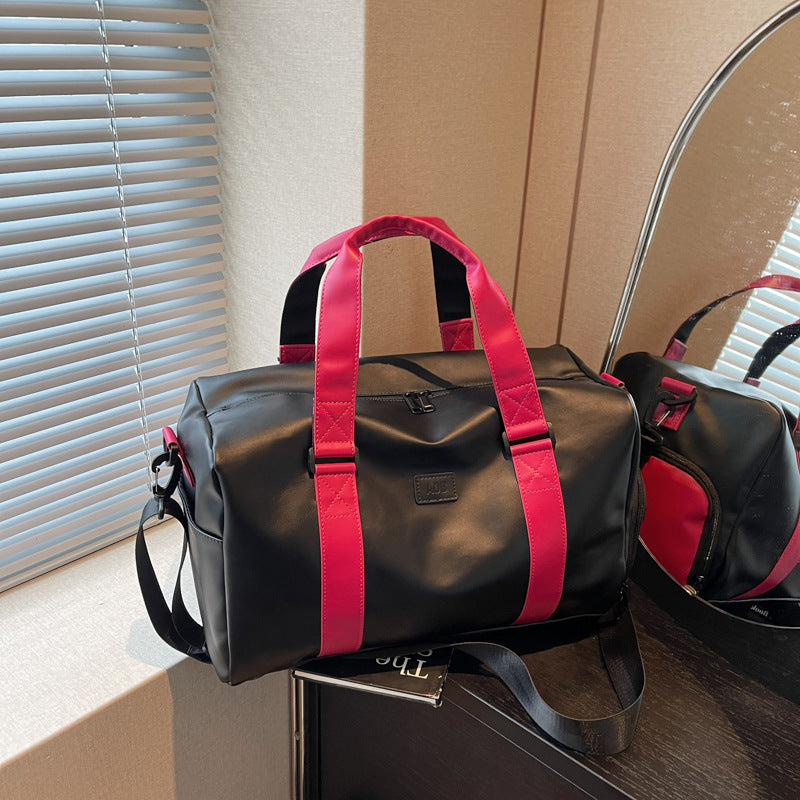 Sporty duffel bag with durable water-repellent material and versatile carrying options Stornfield