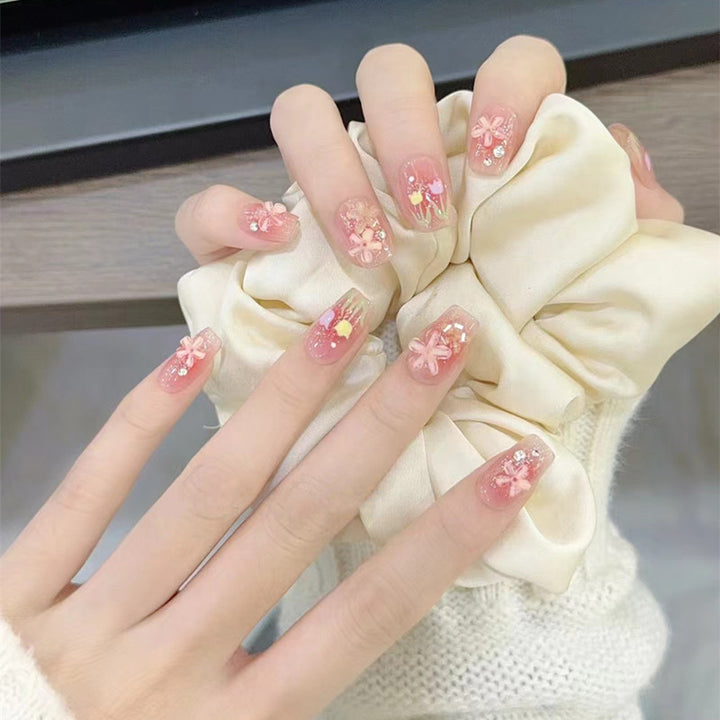 Artificial nails with floral design and glitter effects Stornfield
