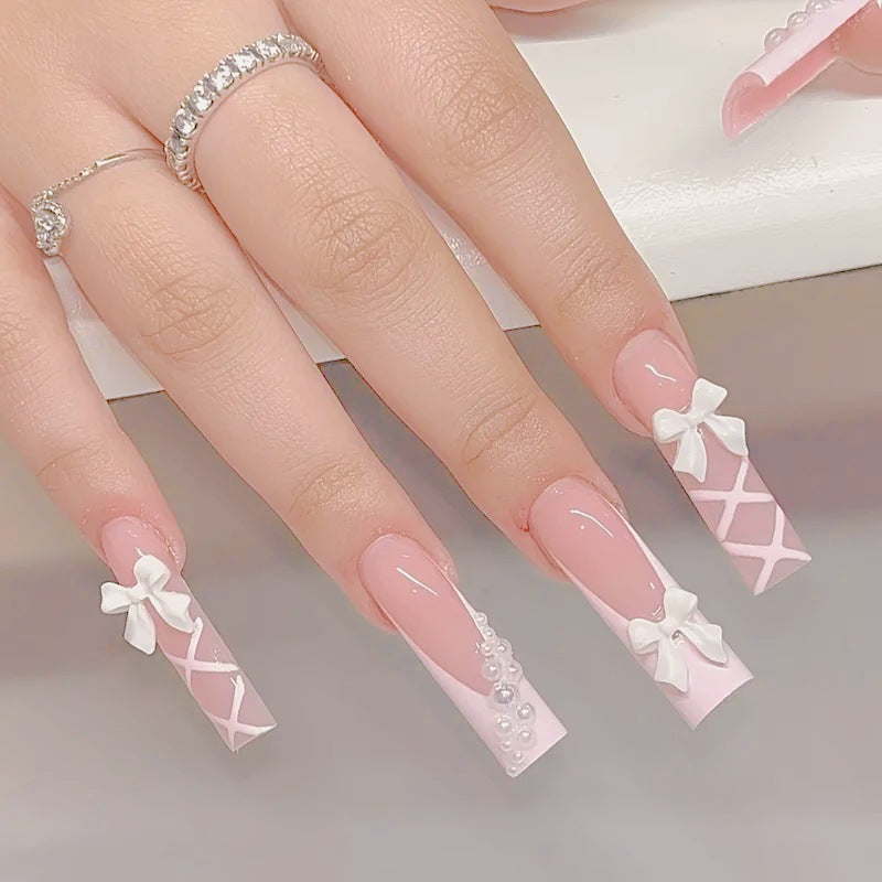Artificial nail set with elegant 3D bows and pearl embellishments Stornfield