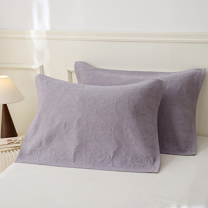 Quilted pillowcase set with paisley relief texture made from breathable cotton blend