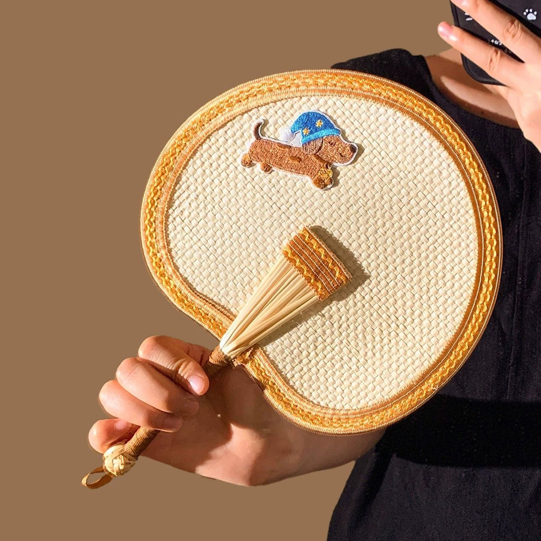 Handcrafted fan with playful dog motif Stornfield