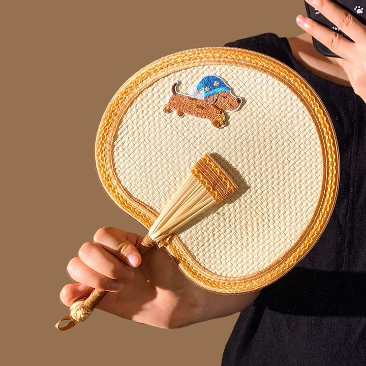 Handcrafted fan with playful dog motif Stornfield