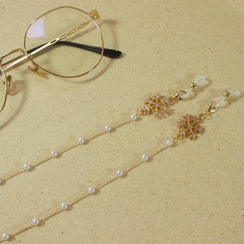 Elegant glasses holder chain with pearls and snowflake pendant Stornfield