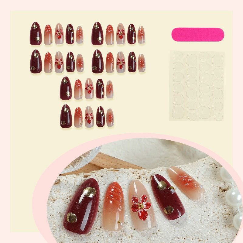Acrylic nail set with elegant floral design and shimmering accents Stornfield