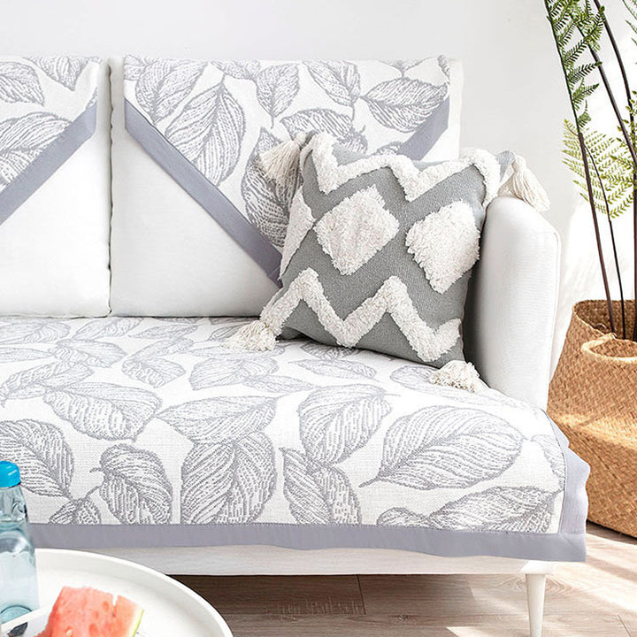 Washable non-slip sofa cover for three-seater couch with leaf pattern