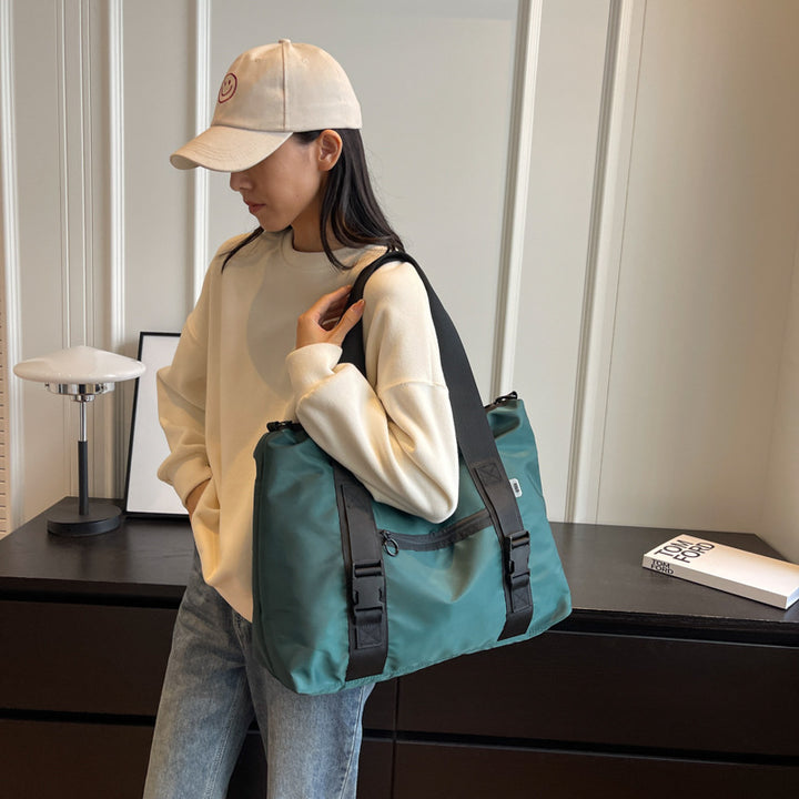 Spacious sports duffel bag with ergonomic carrying handles and water-repellent material Stornfield