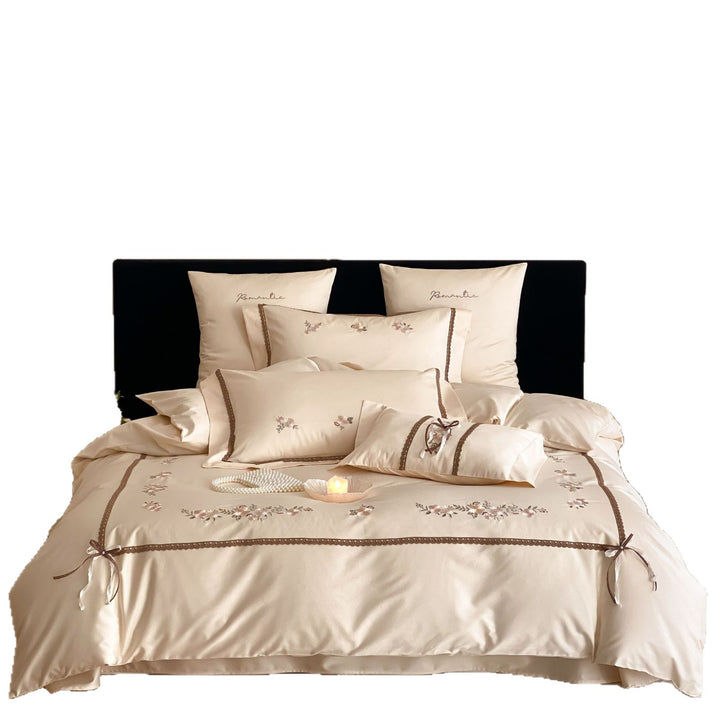 Embroidered bed linen set made of cotton satin with lace trim and floral appliqués