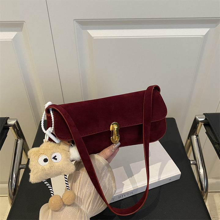 Elegant Suede Handbag with Playful Keychain