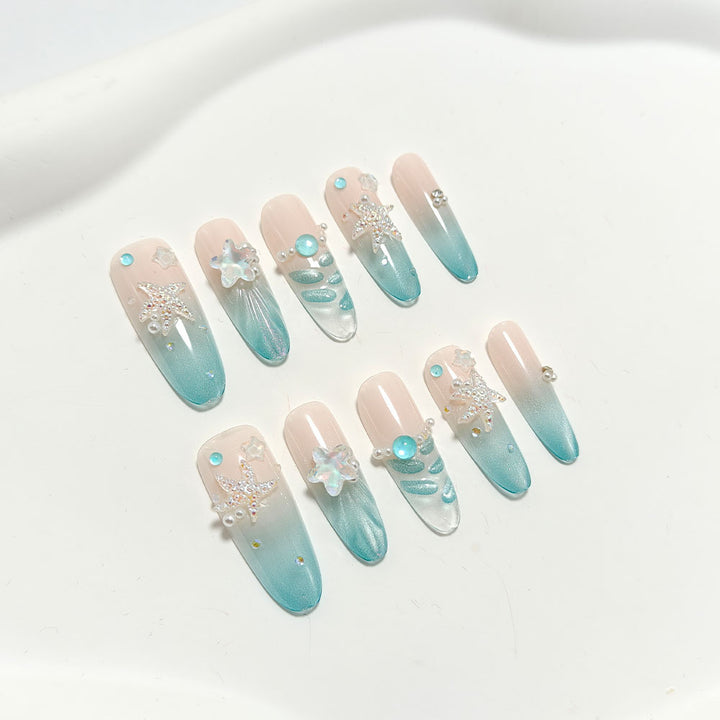 Elegant Nail Art with Ocean Theme and 3D Accents Stornfield