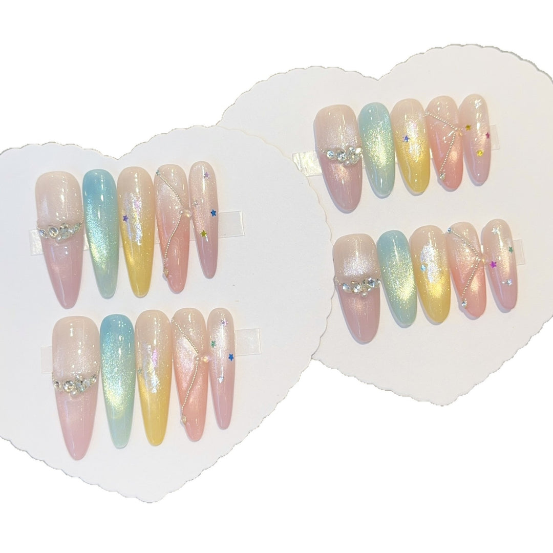 Artificial nails with shimmering effects and sparkling rhinestone details Stornfield