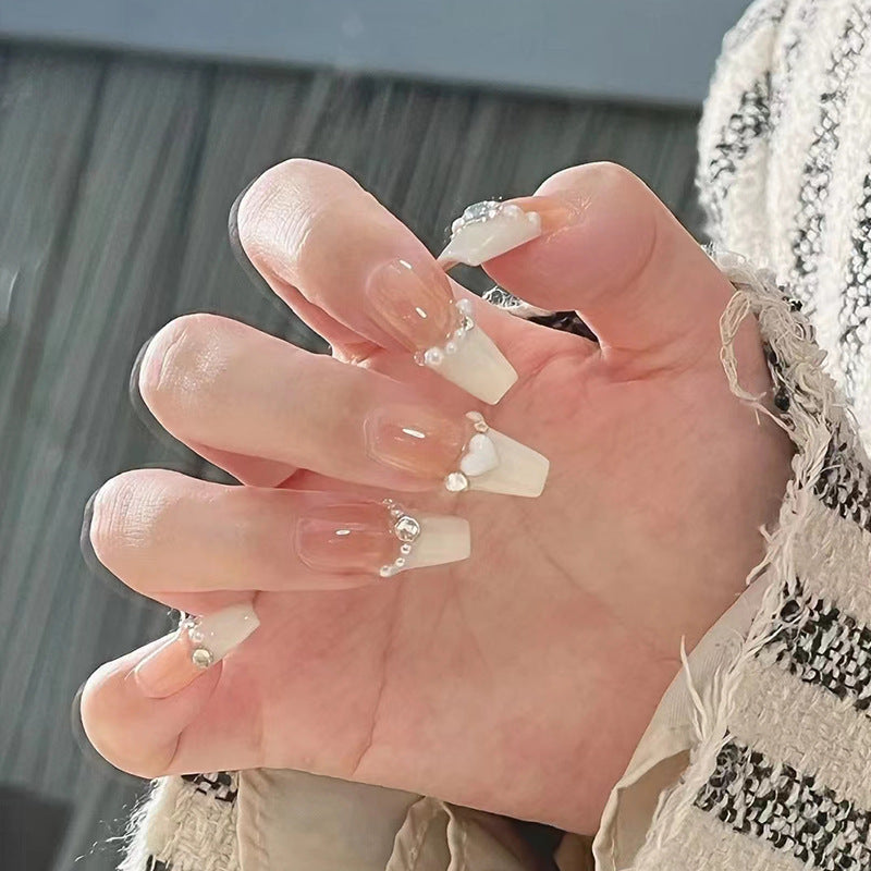 Artificial nails with heart design and glamorous accents Stornfield
