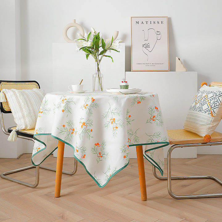 Rectangular tablecloth with botanical orange berry print and contrasting hem piping Stornfield