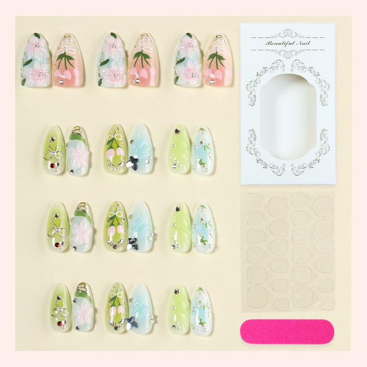 Acrylic nail set with handcrafted floral designs and glitter accents Stornfield