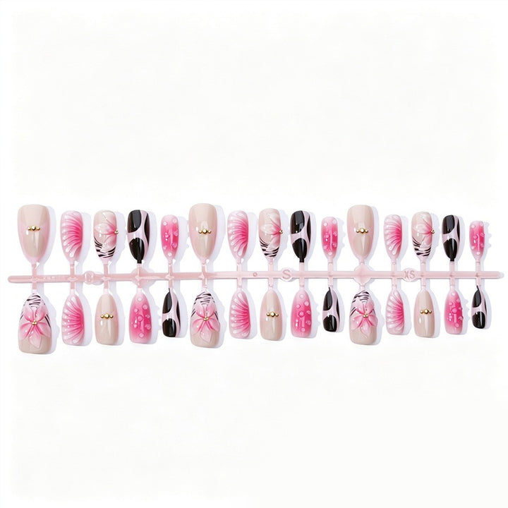 Acrylic nail set with filigree flower and glitter accents Stornfield
