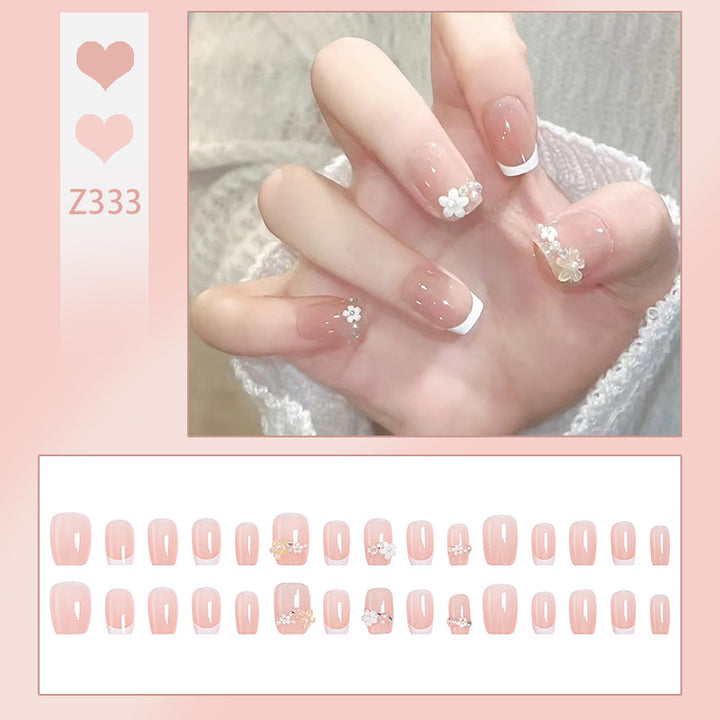 Nail set with elegant flower appliqués and exquisite glitter embellishments Stornfield