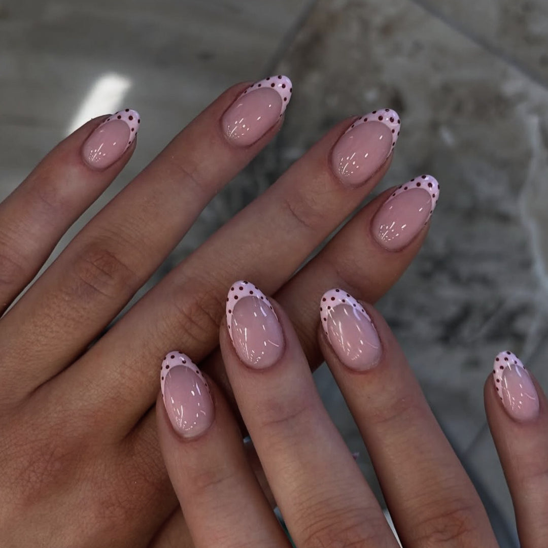 Artificial nail art with playful dots and bows Stornfield