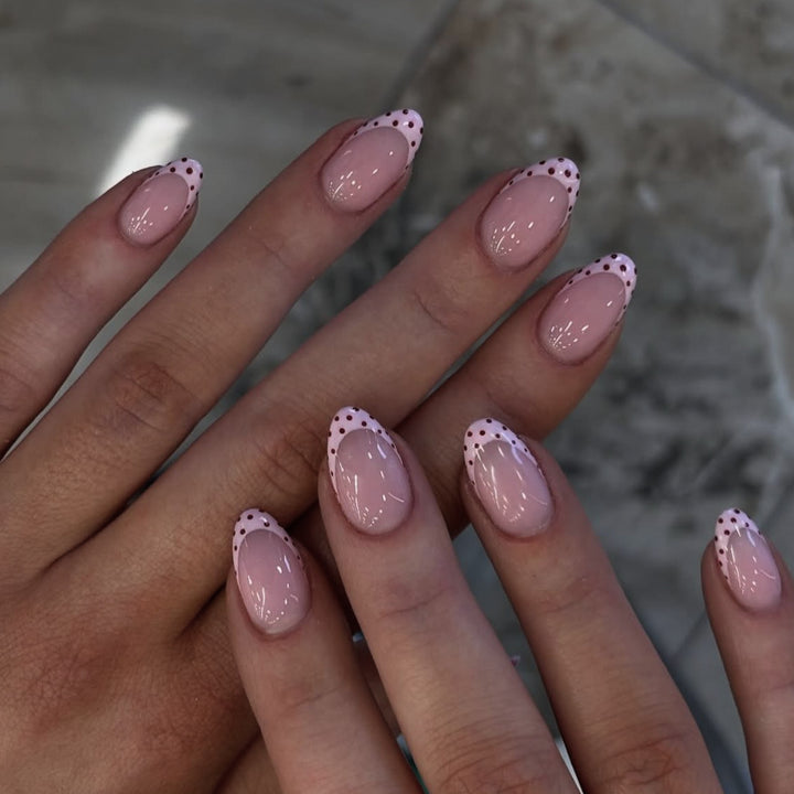 Artificial nail art with playful dots and bows Stornfield