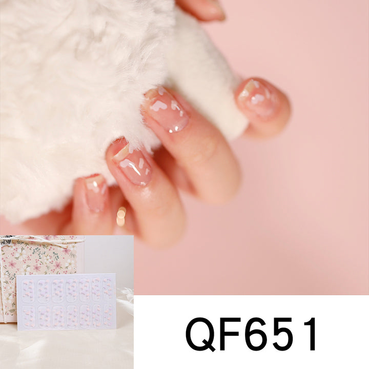 Artificial nail art with heart-shaped designs and soft color gradients Stornfield