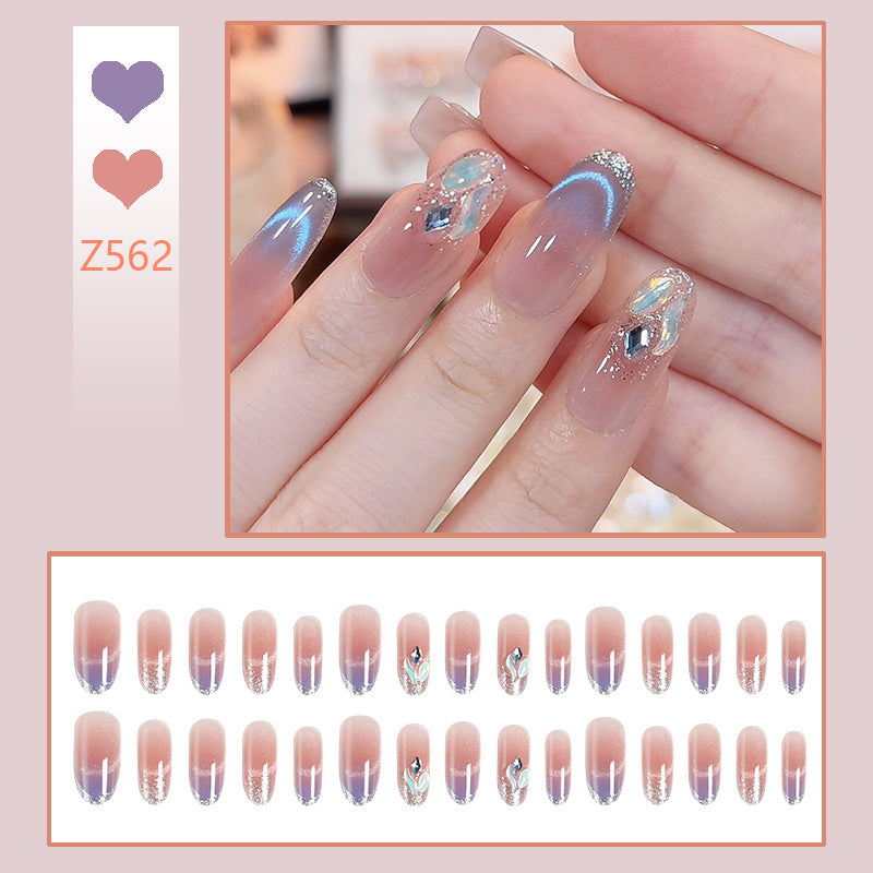 Acrylic nail set with elegant glitter effect and beautified embellishments Stornfield