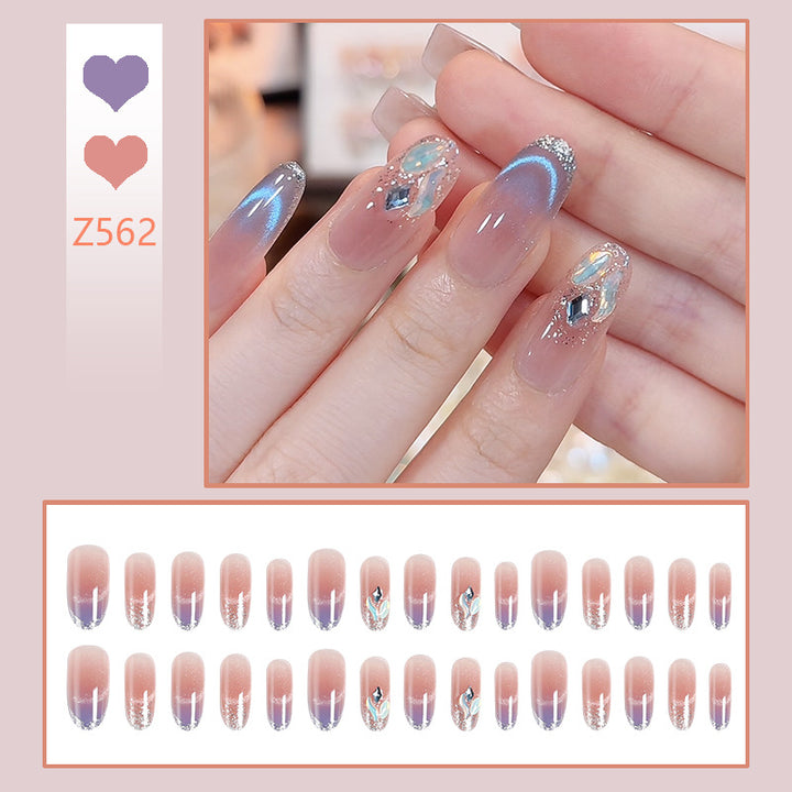 Acrylic nail set with elegant glitter effect and beautified embellishments Stornfield