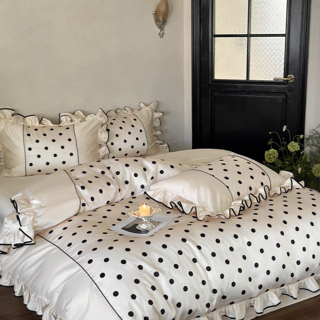 Romantic satin bedding set with ruffles, dots, and fine piping