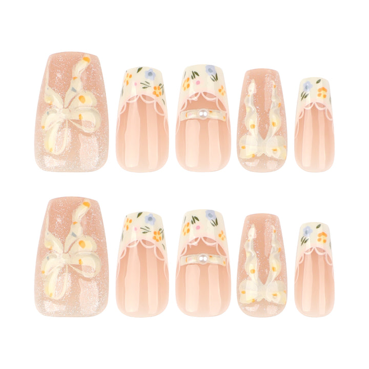 Artful Nail Extensions with Floral Design and Bow Accents Stornfield