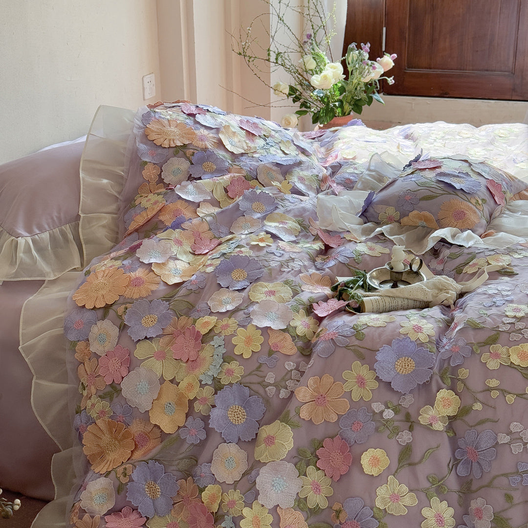 Embroidered bedding set with 3D flower application and ruffle hem