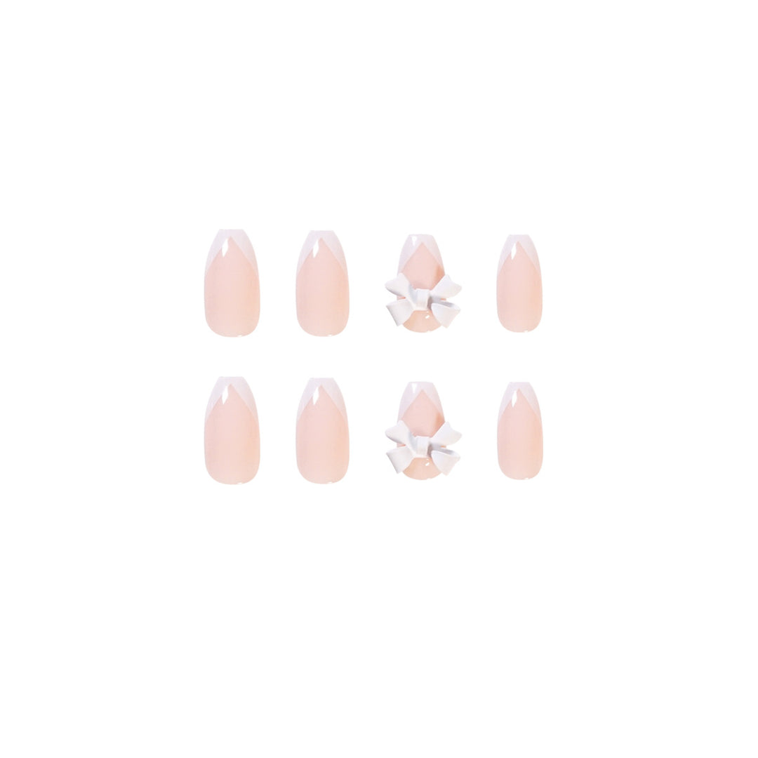 Elegant artificial nails with translucent French tip and decorative floral accents Stornfield
