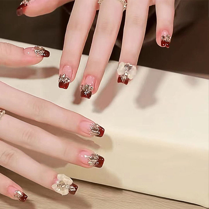 Artificial nails with glamorous floral decorations Stornfield