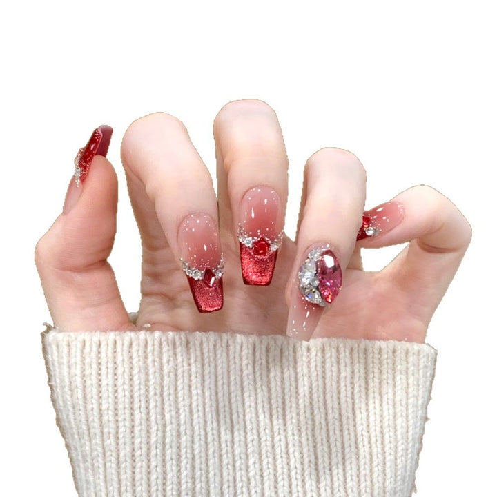 Glamorous artificial nails with sparkling rhinestone applications Stornfield